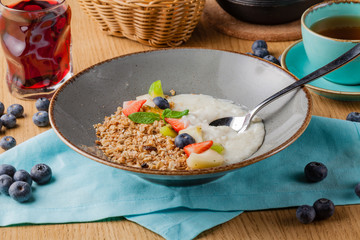 Rice porrige with strawberry on breakfast in cafe