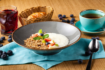 Rice porrige with strawberry on breakfast in cafe