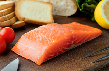 smoked salmon fillet on wooden background