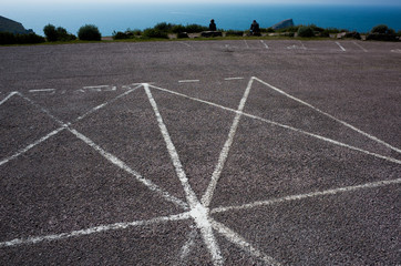 markings on the road in a parking area