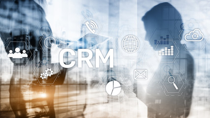 CRM, Customer relationship management system concept on abstract blurred background.