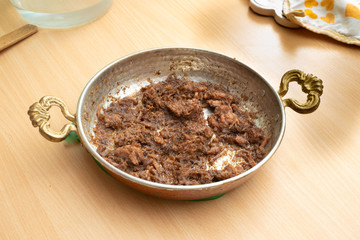 Braised meat in copper pan