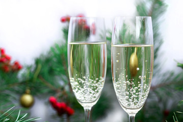 Christmas holiday still-life with champaign, pine branches, red berries