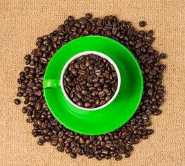 Brown roasted coffee beans, seed on dark background. Espresso dark, aroma, black caffeine drink. Closeup isolated energy mocha, cappuccino ingredient.