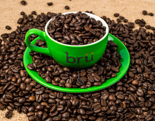 Brown roasted coffee beans, seed on dark background. Espresso dark, aroma, black caffeine drink. Closeup isolated energy mocha, cappuccino ingredient.