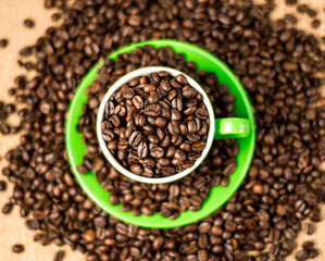Brown roasted coffee beans, seed on dark background. Espresso dark, aroma, black caffeine drink. Closeup isolated energy mocha, cappuccino ingredient.