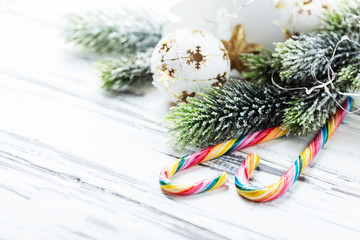 Christmas decoration with sugar candy on white table, selective focus