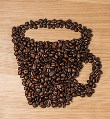 Brown roasted coffee beans, seed on dark background. Espresso dark, aroma, black caffeine drink. Closeup isolated energy mocha, cappuccino ingredient.