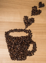 Brown roasted coffee beans, seed on dark background. Espresso dark, aroma, black caffeine drink. Closeup isolated energy mocha, cappuccino ingredient.