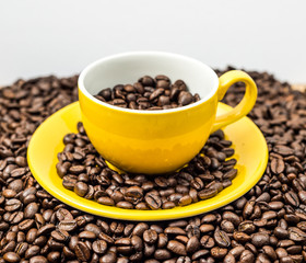 Brown roasted coffee beans, seed on dark background. Espresso dark, aroma, black caffeine drink. Closeup isolated energy mocha, cappuccino ingredient.