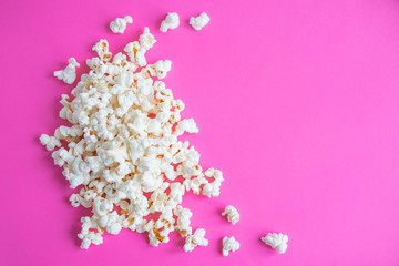 Background with a popcorn. Pink background with popcorn. Place for inscription