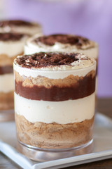 Chocolate tiramisu jar cakes on white plate