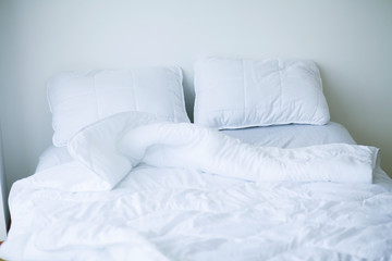 Fototapeta na wymiar Good morning. Bed and pillows in white flat