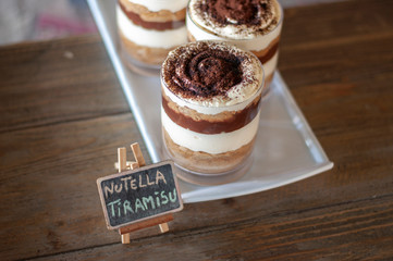 Chocolate tiramisu jar cakes on white plate