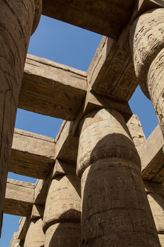 The mighty pillars or columns of the ancient temple complex of the opern air museum in Karnak in Luxor, Egypt