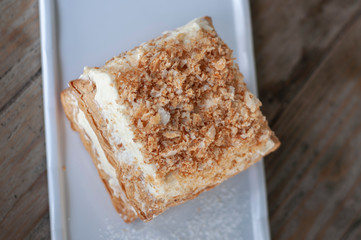 Mille-feuille is known vanilla or custard slice on white plate