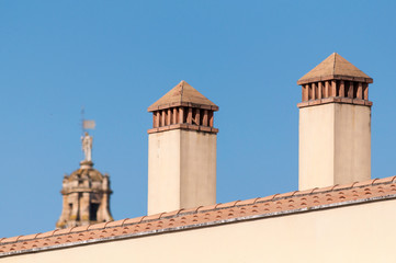 chimneys and tower in fuzzy background