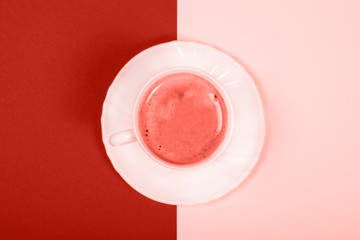 White cup of coffee on double-tone background