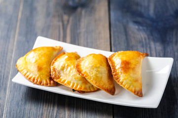 Empanada  -dumplings stuffed with meat and vegetable.