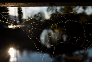 A spider web on the city of Edessa, with the bridge of Kioupri on the background, Macedonia, Greece