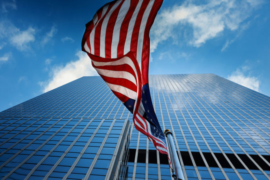 View Of American Flag On Blue Building Background