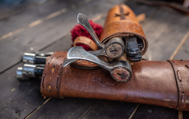 Set of three throwing axes in leather sheath