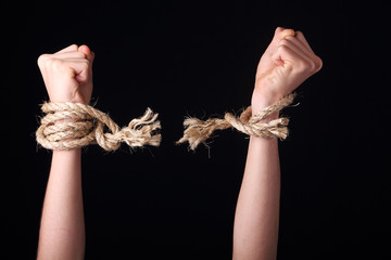 Free person showing a frayed rope