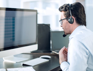 close up.businessman looking at the monitor of a modern computer