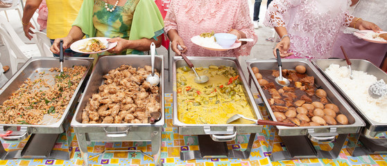 Food Buffet Catering Dining Eating Party Sharing Concept.people group catering buffet food indoor in luxury restaurant with meat colorful fruits and vegetables