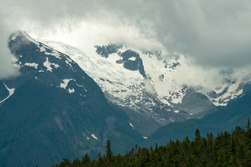 Storm clouds gather over the glacier on Oscar Peak in British Columbia, Canada