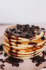 Stack of delicious homemade pancakes with sauce