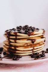 Stack of delicious homemade pancakes with sauce