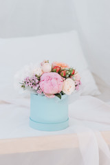 Beautiful spring bouquet with tender flowers in box