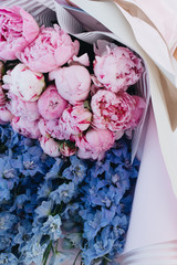 Beautiful spring bouquet with tender blue and pink flowers