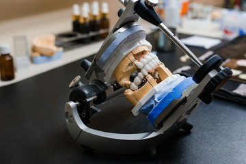 Dental technician tools with articulator in dental laboratory