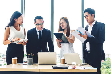 Group of casual business discussing and working with laptop computer.creative business people planning and brainstorm in modern workloft.Teamwork concept