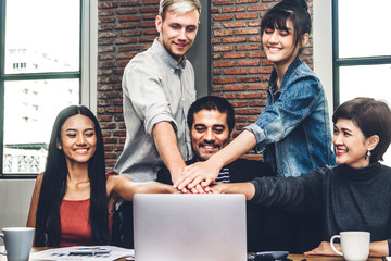 Successful of group business people stack and putting their hands together at office.Friendship...