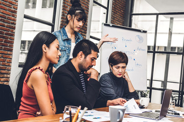 Group of casual business discussing and working with laptop computer.creative business people planning and brainstorm in modern workloft.Teamwork concept