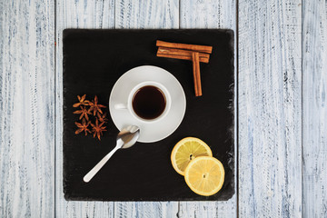 hot coffe, cinnamon sticks, star anise and lemon