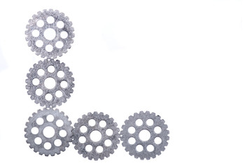 Old vintage antique hour metal gears, cogwheels isolated on white background