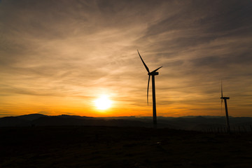 Fototapeta na wymiar Dusk on Mount Oiz, Basque Country, with wind energy gathering