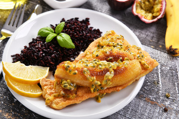 Traditional madeira dish - scabbardfish with bananas and passion fruit