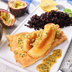 Traditional madeira dish - scabbardfish with bananas and passion fruit
