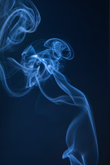 Abstract blue smoke swirls