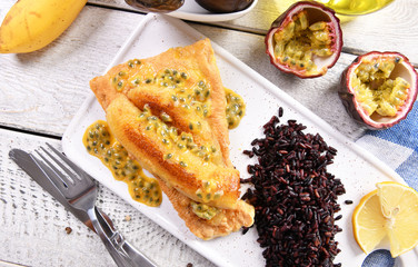 Traditional madeira dish - scabbardfish with bananas and passion fruit