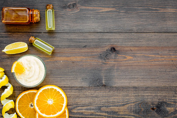 organic cosmetics for homemade spa with orange oil wooden background top view mockup
