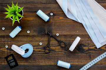 Tailor shop with thread, scissors, fabric. Sewing as hobby. White background top view