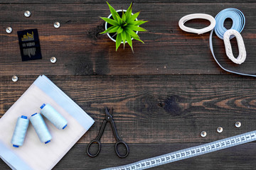 Tailor shop with thread, scissors, fabric. Sewing as hobby. White background top view mockup