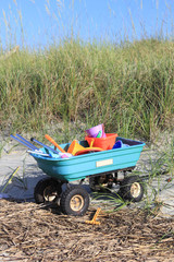 Sand cart piled with toys ready for some beach fun