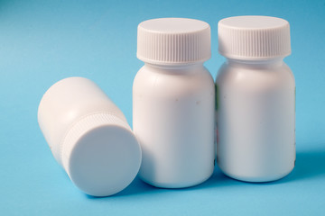 White bottles on blue background